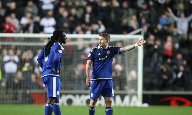 Aron Gunnarsson and Kenwyne Jones appear to be having a difference of opinion after MK Dons' winning goal - Gunnar was one of a few City players to miss good first half chances, while Kenwyne's clearance off the line to prevent a home goal,, added to the feeling that much of his best work this season has come when he has been defending.*