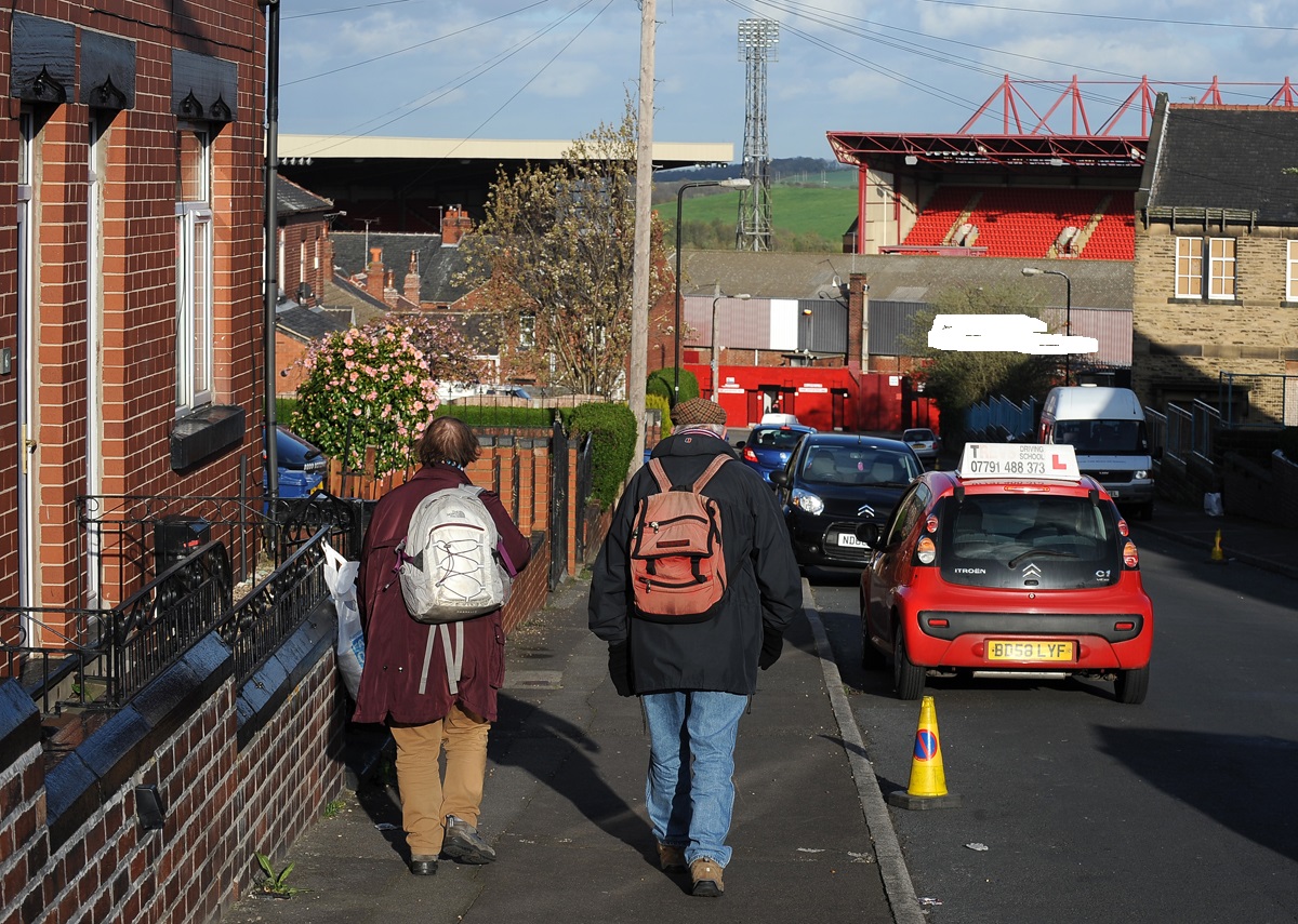 Two veteran fans make their way to Oakwell as the sun beams down in South Yorkshire. PRESS ASSOCIATION Photo. Picture date: Tuesday April 8, 2014. See PA story SOCCER Barnsley. Photo credit should read: Nigel French/PA Wire. RESTRICTIONS: Editorial use only. Maximum 45 images during a match. No video emulation or promotion as 'live'. No use in games, competitions, merchandise, betting or single club/player services. No use with unofficial audio, video, data, fixtures or club/league logos. Ref #: PA.19515426